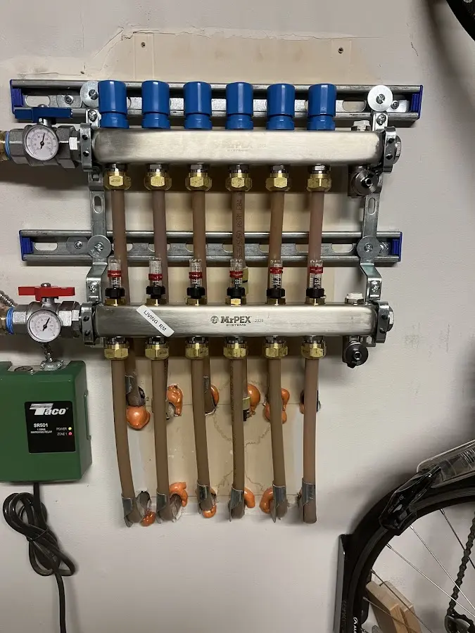 Plumber performing Water Heater Repair at a residential property in Towson